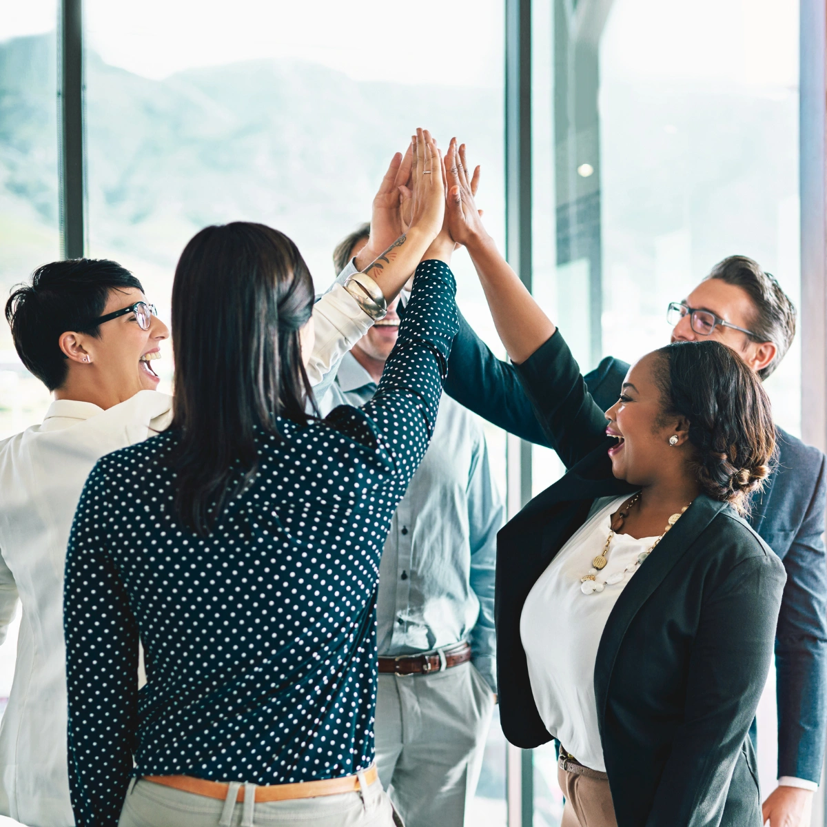 Group of professionals high five